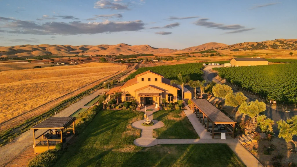 McGrail Vineyards estate surrounded by golden Livermore Valley hills at sunset.
