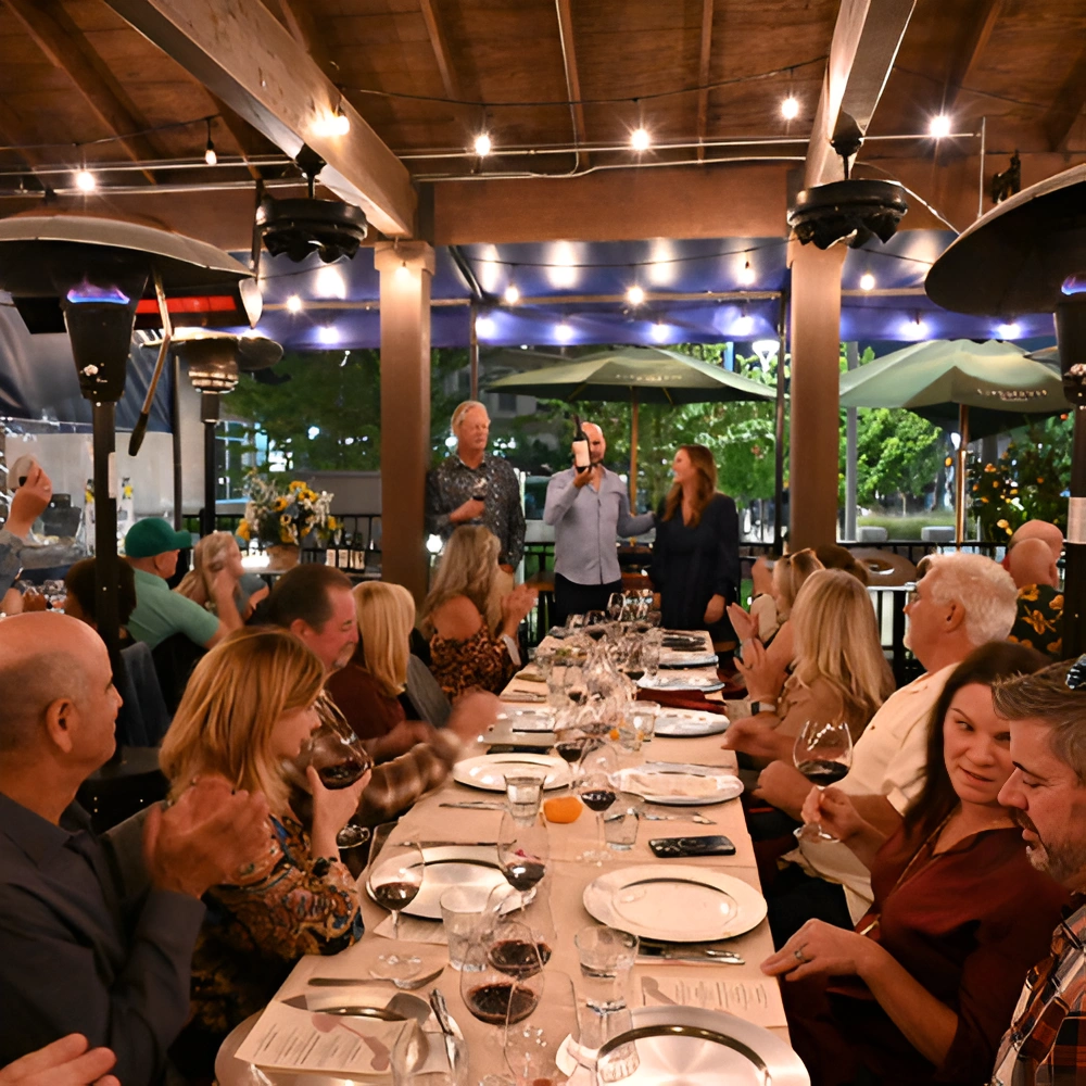McGrail Vineyards guests enjoying a private wine dinner with estate wines and vineyard hospitality in the Livermore Valley tasting venue. 